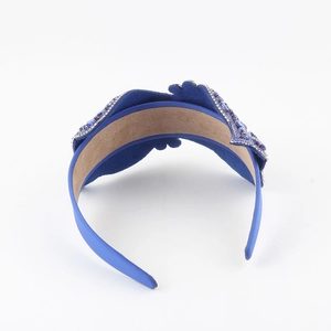 Deep royal blue velvet headband featuring luxury crystal wave pattern rhinestones
