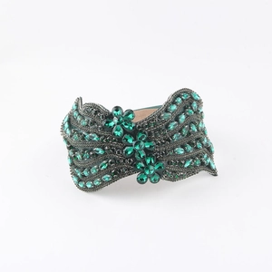 Vintage luxury wide headband with dark green crystals and floral rhinestone design