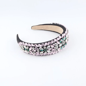 Baroque wide headband with pink and green crystals on black velvet base, 45-degree angle