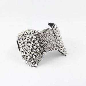 Detail of baroque black headband featuring intricate crystal rhinestones and gemstones