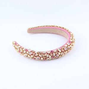 Detailed close-up of handmade baroque headband with pink crystals and intricate beadwork
