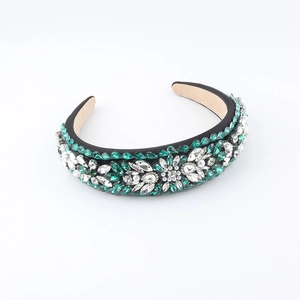 Baroque padded headband with green rhinestones, crystals and pearls on black base