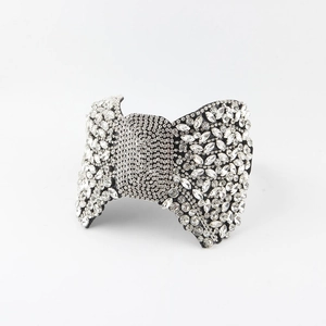 Detailed macro view of baroque headband with sparkling crystals and bow design