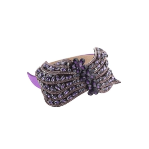 Luxurious purple rhinestone headband featuring intricate marquise crystal wave patterns