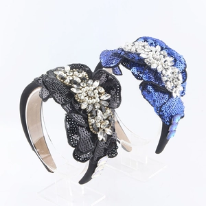 Detail of baroque wide headband with sequins, faux pearls and sparkling rhinestones