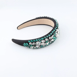 Baroque padded headband with green and clear rhinestones on black fabric base