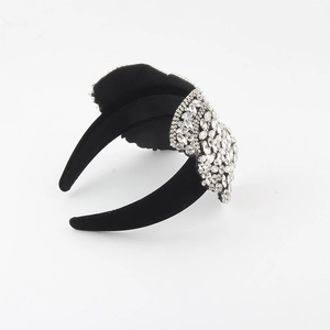 Baroque black velvet headband featuring sparkling rhinestones and an elegant bow design