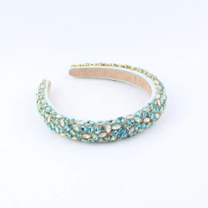 Baroque style wide headband with sparkling blue and iridescent rhinestones on gold frame