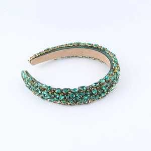 Baroque style emerald green crystal headband with intricate gemstone embellishments