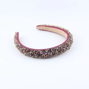 Baroque padded headband featuring luxury purple crystals and heavy beadwork design