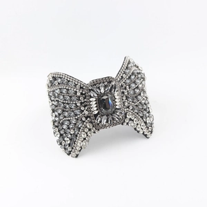 Baroque crystal bow headband with grey rhinestones and large center stone for parties