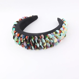 Detail of colorful sequins on thick sponge headband with a rainbow laser finish