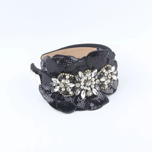 Detail of black sequin floral headband with crystals and faux pearls for a luxury look