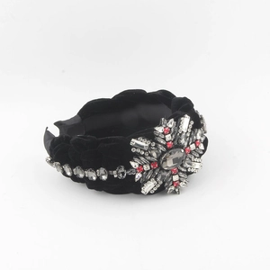 Elegant black velvet twisted headband with sparkling crystal floral cluster embellishments