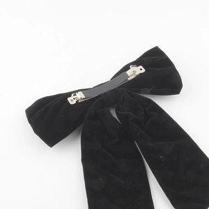 Elegant black velvet bow hair clip featuring a high-quality silver metal spring fastener