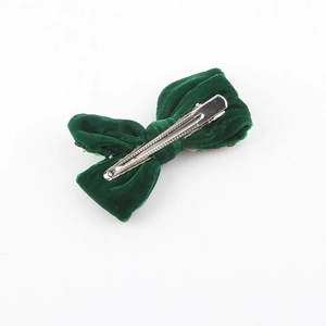 Barrette à cheveux nœud de Noël en velours vert avec pince à ressort argentée
