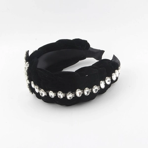 Detail of wide black velvet braided headband with sparkling rhinestone embellishments
