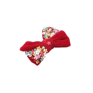 Barrette nœud de Noël en velours rouge ornée de paillettes festives étoiles et flocons