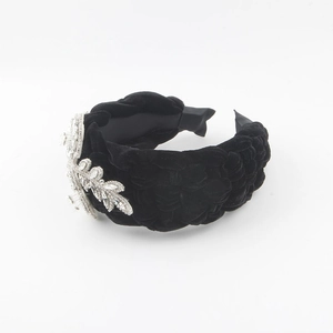 Fashionable black velvet braided headband with sparkling rhinestone flower and leaf decor