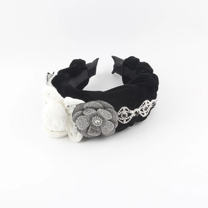 Elegant black velvet headband with white camellia flowers and rhinestone lace accents