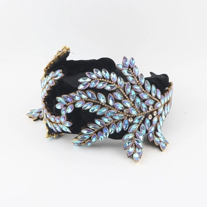Detail of baroque velvet headband with gradient blue crystal leaves and small rhinestones
