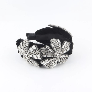 Baroque style velvet headband with large crystal flowers and braided luxury design