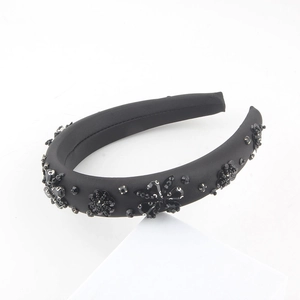 Elegant black padded headband with handmade sequin flower beads on satin fabric