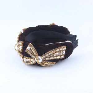 Velvet braided headband featuring luxury pearl and rhinestone bow decoration