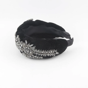 Detail of black velvet headband with sparkling marquise rhinestones in sunburst design