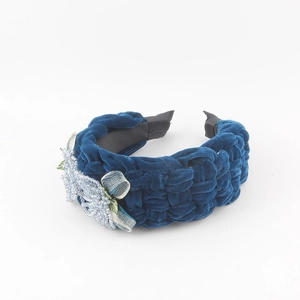 Macro detail of navy blue velvet braided headband with exquisite crystal flower beadwork