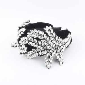 Close-up of luxury black velvet headband with marquise-cut crystal vine leaves patterns