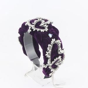 Detail of purple velvet braided headband with heart rhinestones and dangling tassels