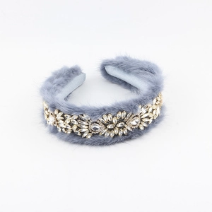 Detail of grey faux fur padded headband with sparkling crystal floral and leaf patterns