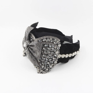 Luxury black velvet headband with a large crystal-encrusted bow and sparkling rhinestones