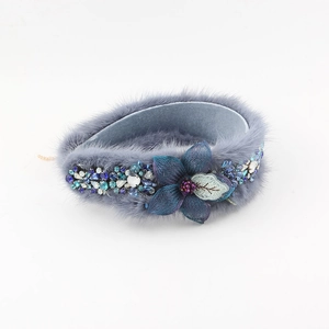 Blue faux mink fur padded headband with floral mesh and sparkling rhinestone details