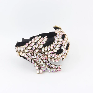 Detailed view of luxury black velvet headband with marquise AB rhinestones in leaf patterns