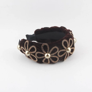 Brown velvet braided headband featuring gold rhinestone flowers and elegant pearls