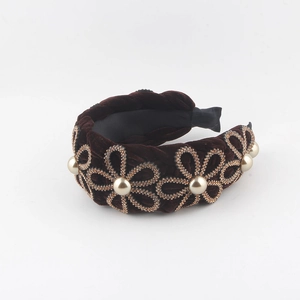 Detail of coffee velvet headband featuring gold rhinestone flowers and white pearls