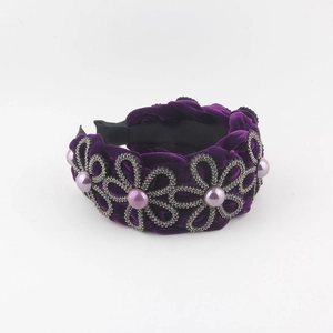 Purple velvet headband with rhinestone snowflake patterns and faux pearl embellishments