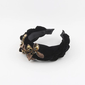 Detailed close-up of velvet headband featuring three vintage gold butterfly crystal ornaments