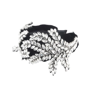 Baroque style velvet headband featuring intricate crystal leaf patterns and padded design