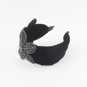 Baroque black velvet wide headband featuring a large handcrafted flower with black crystals