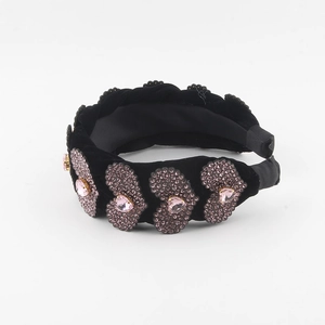 Black velvet padded headband with pink rhinestone heart crystals and wide braided design