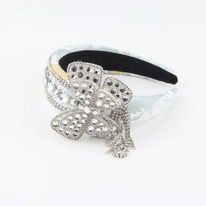 Cerchietto barocco azzurro a fiori con farfalla di strass e nappe brillanti per donna