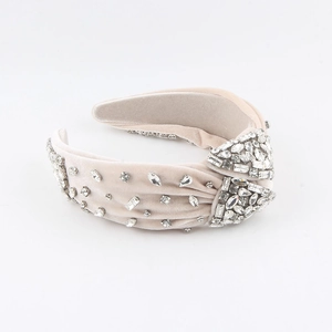 Beige velvet padded headband with hand-sewn sparkling crystals and elegant top knot design