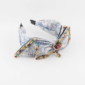 Luxurious light blue floral headband with colorful rhinestones and faux pearls bow