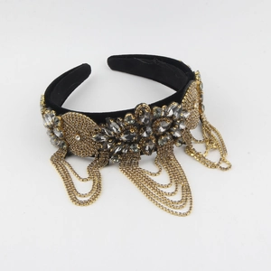 Detailed shot of Baroque velvet headband with grey rhinestones and hanging gold chains
