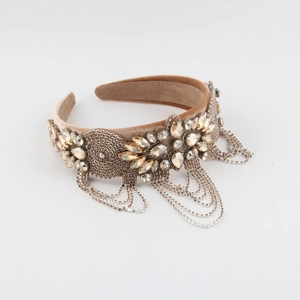 Detail of champagne gold wide headband with crystal flower clusters and hanging tassels