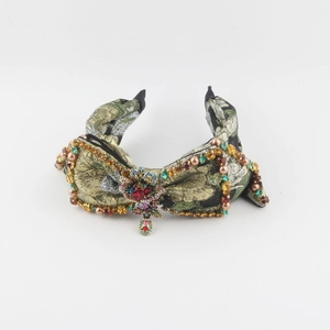 Green and gold jacquard headband with luxury rhinestones and pearl embellishments