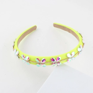 Detail of neon green headband with butterfly crystals and small rhinestones on suede lining